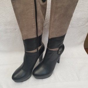 New and unworn all leather tall heeled boot .